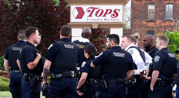 Police officers secure the scene after a shooting at TOPS supermarket in Buffalo, New York, U.S. May 14, 2022.