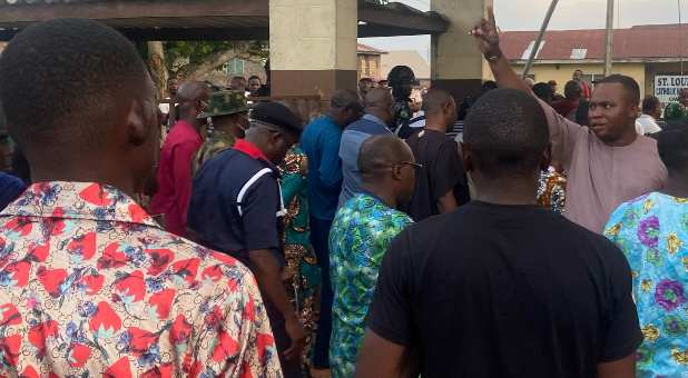 Relatives of churchgoers who were attacked by gunmen during Sunday's church service gather as health workers attend to victims brought in by ambulance after the attack at St. Francis Catholic Church, in Owo, Nigeria June 5, 2022.