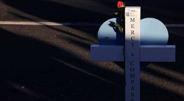 A floral tribute is placed at a memorial after a mass shooting at an LGBTQ nightclub in Colorado Springs, Colorado, U.S., November 21, 2022