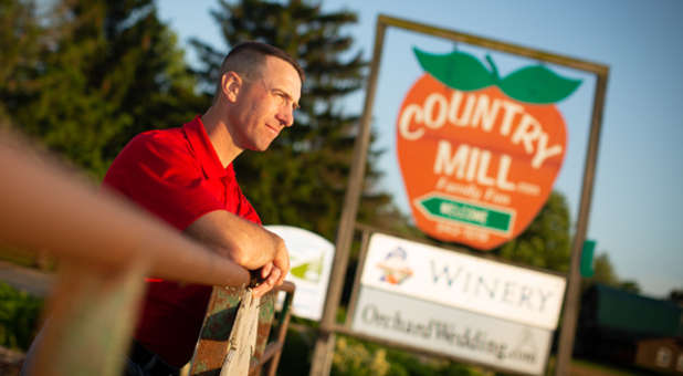 Tennes standing at his family farm.