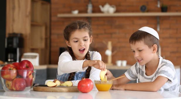 Jewish children celebrating Rosh Hashanah.