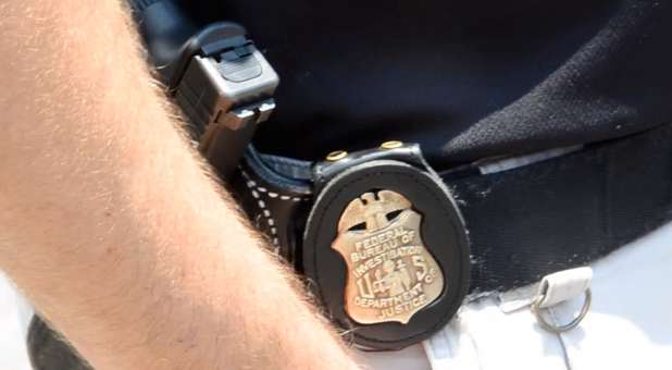 Badge on an FBI agent