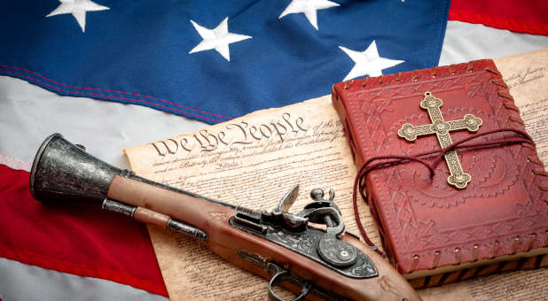 American flag overlaid with gun, cross, Bible, U.S. Constitution