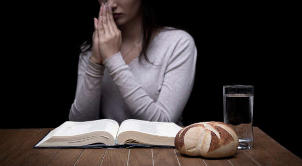 A woman fasting and praying.