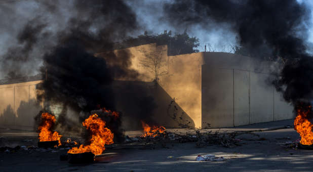 Tires set ablaze in Haitian streets.