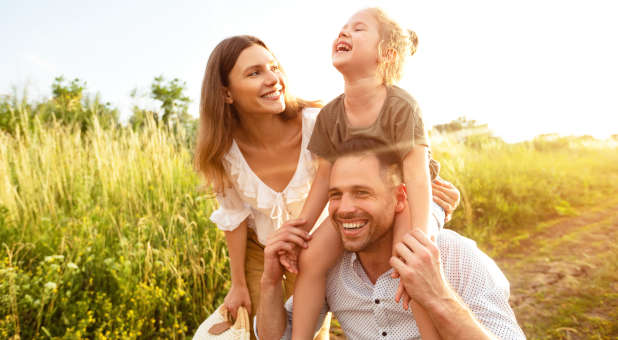 A happy family outside.