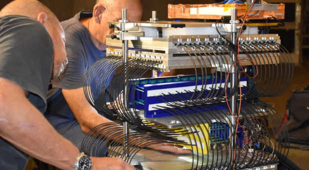 Researchers working with a muon machine.