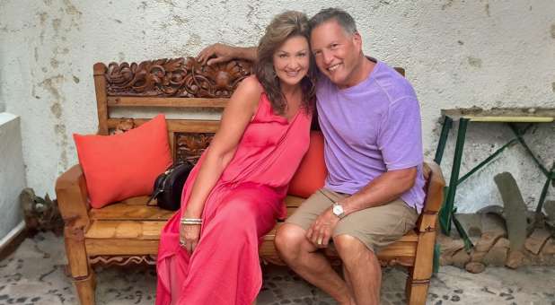 Joni Lamb and Doug Weiss sitting on bench