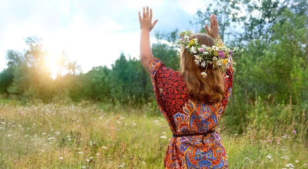 A woman praying to nature.