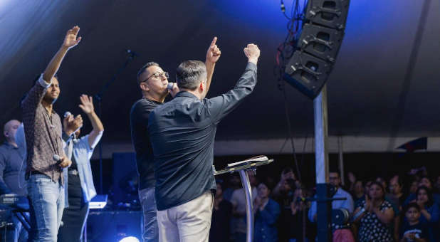 Speakers on stage for Revival at the Border.